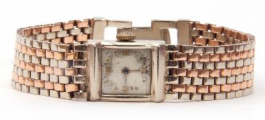 Third quarter of 20th century ladies un-named 14K gold cased cocktail watch having silvered hands to