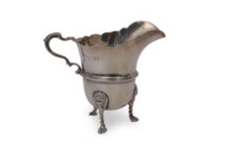 Edward VII large cream jug of helmet shape, having card cut rim, leaf capped scrolled handle and