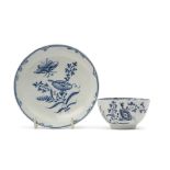 Unusual Lowestoft porcelain tea bowl and saucer decorated in underglaze blue with a botanical type