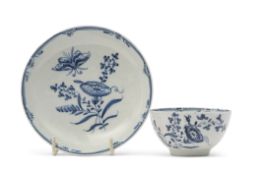 Unusual Lowestoft porcelain tea bowl and saucer decorated in underglaze blue with a botanical type