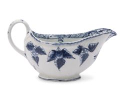 Rare Lowestoft sauce boat, the body relief moulded with acorns and painted in underglaze blue with