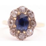 Sapphire and diamond cluster ring, the oval cut sapphire multi-claw set with 8 old cut diamond