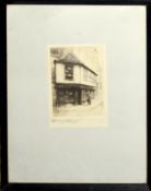 Edward J Cherry, (1886-1960), Figure by a shop window, black and white etching, signed in pencil