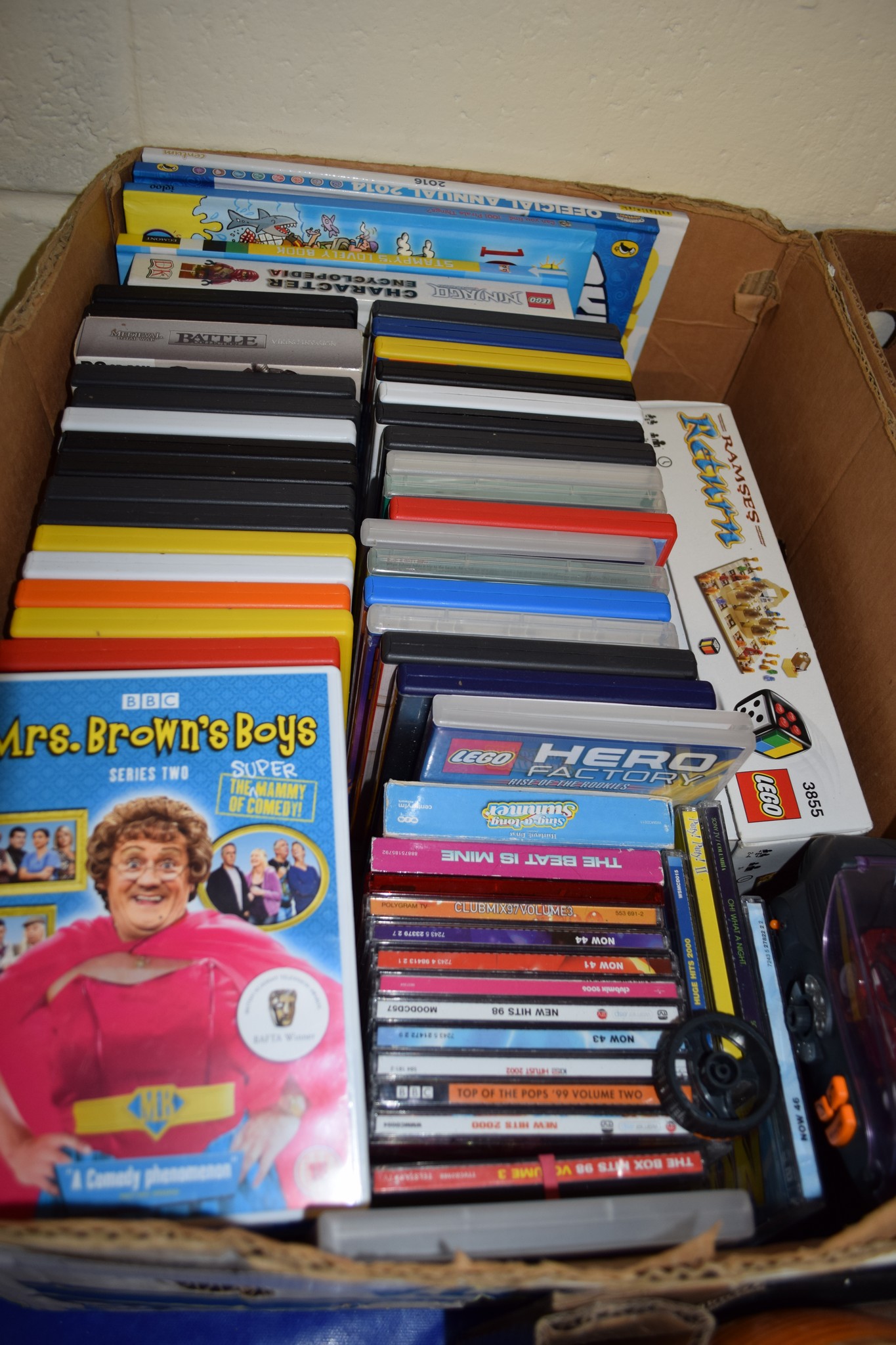 BOX CONTAINING DVDS AND SOME TOYS