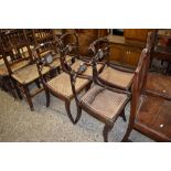 SET OF FOUR REGENCY STYLE CANE SEAT DINING CHAIRS WITH SABRE LEGS (ONE A/F)