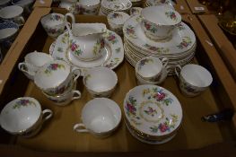 BOX CONTAINING DINNER WARES DECORATED WITH FLORAL DESIGN