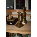 TWO BRASS CANDLESTICKS AND MONEY BOX
