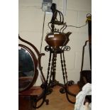 COPPER KETTLE ON A WROUGHT METAL STAND