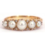 Victorian 18ct gold, pearl and diamond ring, a design featuring five cultured pearls, highlighted