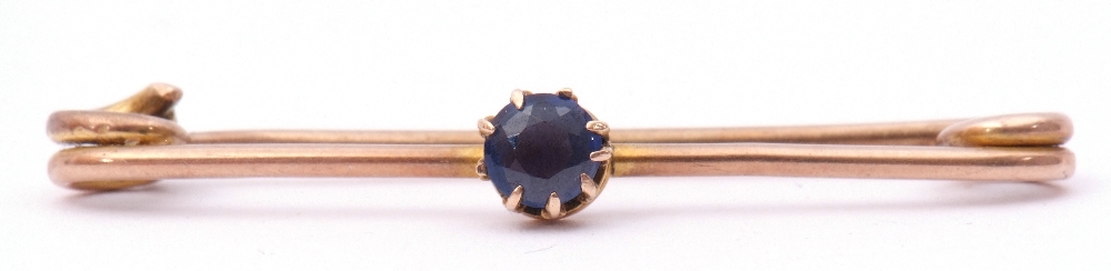 Antique sapphire set pin brooch, the circular shaped sapphire multi-claw set and raised on a