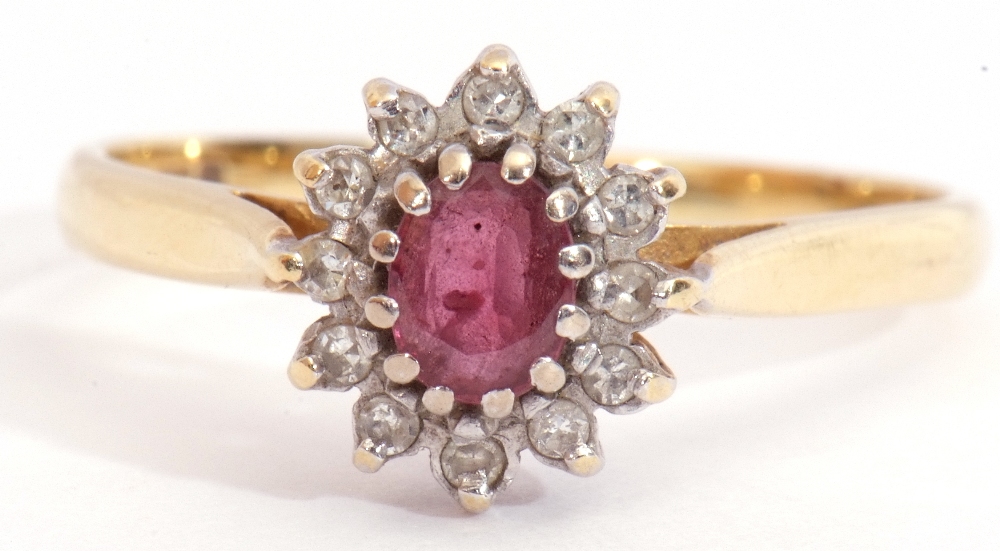 Ruby and diamond cluster ring, featuring an oval faceted small ruby, multi-claw set and raised - Image 8 of 8