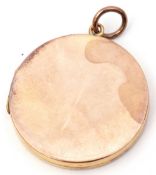 Low grade yellow metal circular hinged locket of plain polished design, 26mm diam, g/w 6.6gms