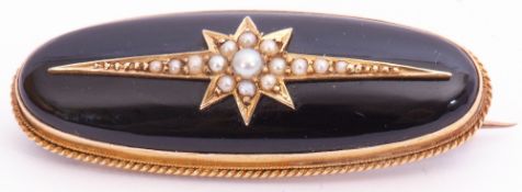 Victorian onyx and pearl brooch of oval form, the slightly curved onyx panel applied with a seed