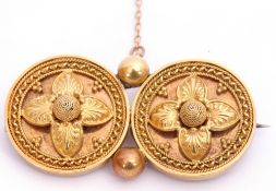 Victorian yellow metal Etruscan brooch, a design featuring two circular discs joined with two beads,