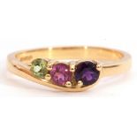 18ct gold gem set ring, a stylised design with graduated round cut amethyst, tourmaline, and