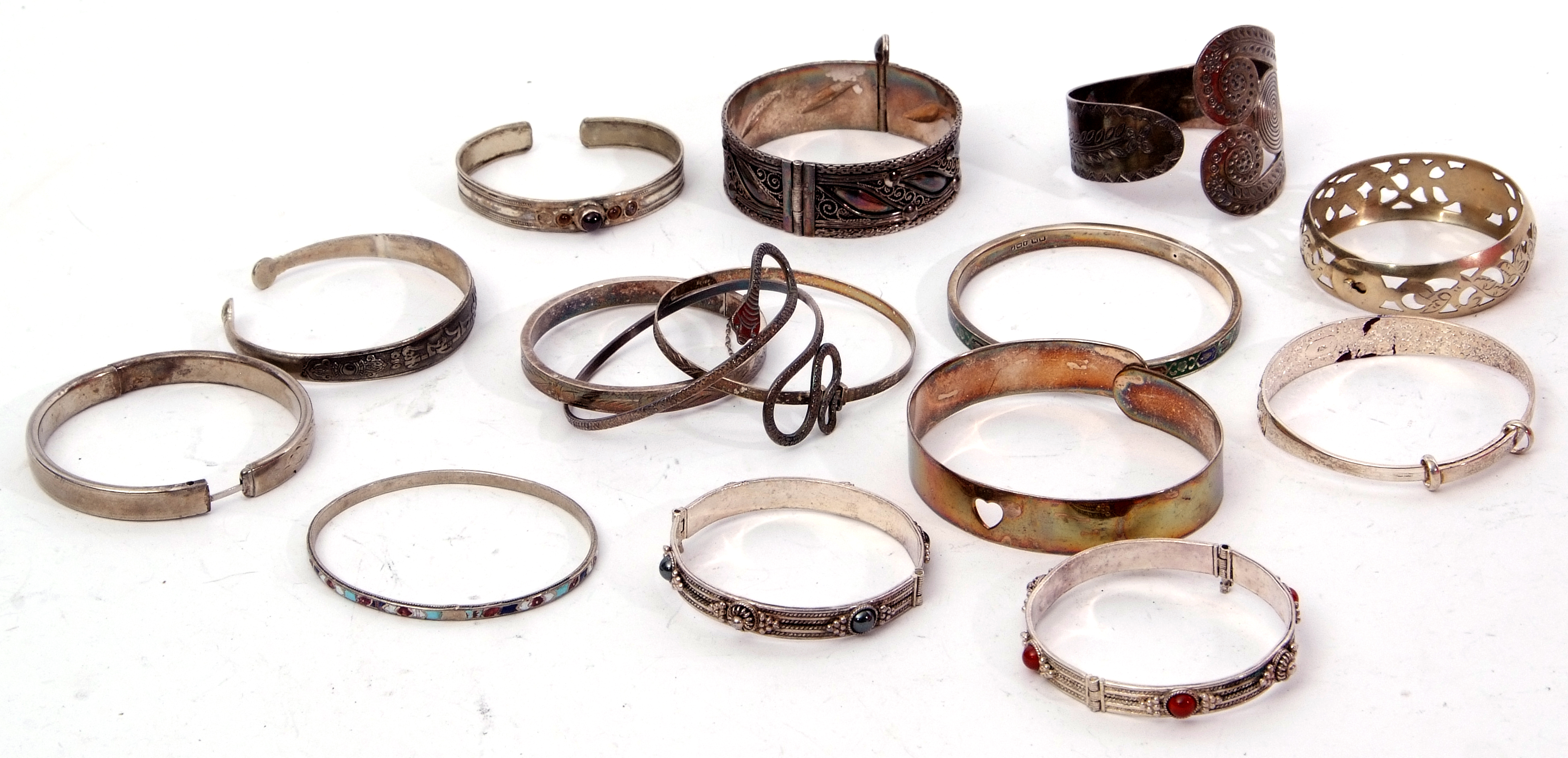 Mixed Lot: silver and enamel bangle, Birmingham 1923, three white metal bracelets, stone and