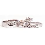 Three white metal and diamond set rings each stamped 925 and highlighted with small single cut