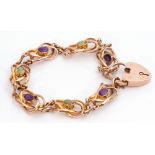 9ct gold amethyst and peridot set bracelet featuring seven open work scroll links, four with oval