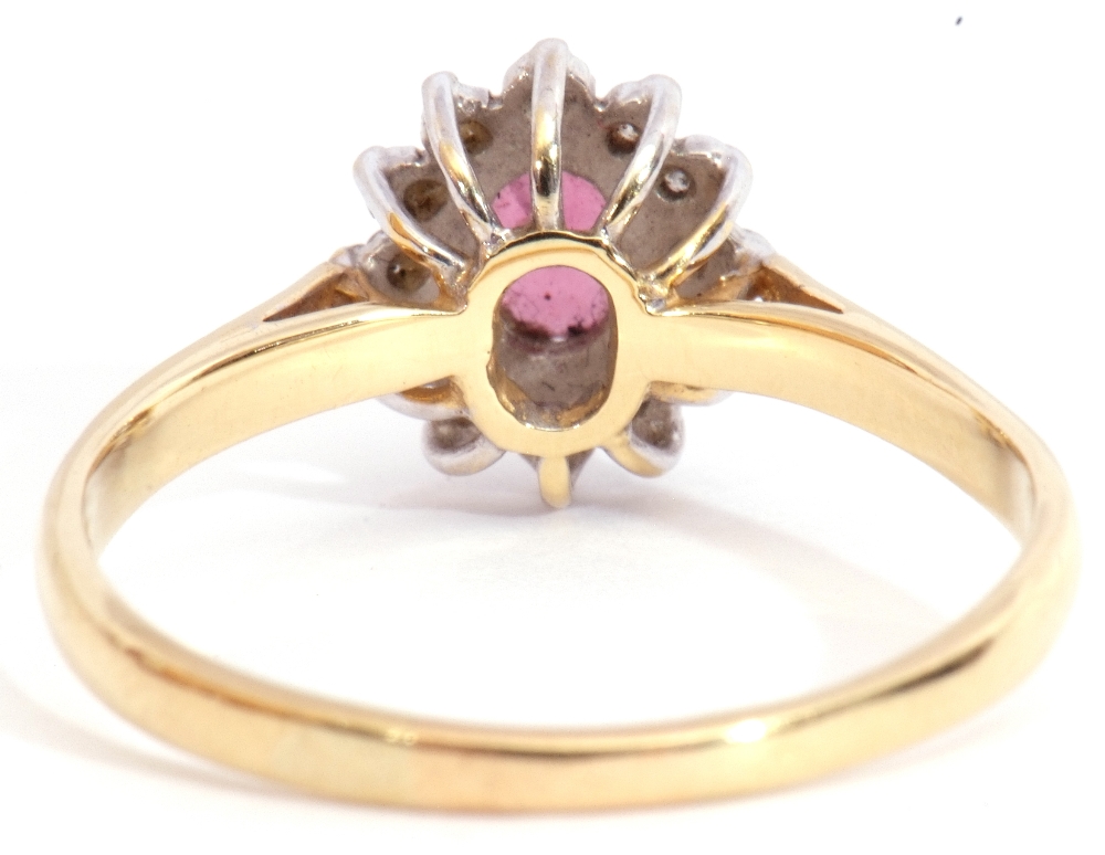 Ruby and diamond cluster ring, featuring an oval faceted small ruby, multi-claw set and raised - Image 4 of 8