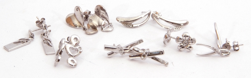 Mixed Lot: seven pairs of white metal earrings highlighted with small single cut diamond(s), each - Image 2 of 2