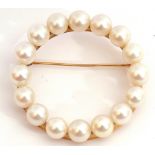 Large cultured pearl brooch featuring 16 cultured pearls set into petal edged cups, all in a garland