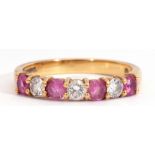 18ct gold ruby and diamond half-hoop ring set with four round pink rubies, interspersed with three