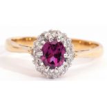 18ct gold amethyst and diamond cluster ring, the oval faceted amethyst multi-claw set and raised