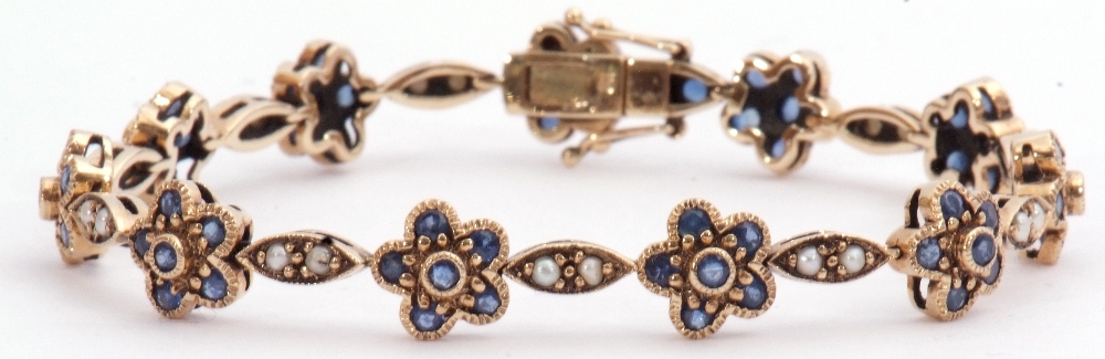 9ct gold sapphire and seed pearl bracelet featuring 21 links alternating with 11 sapphire clusters