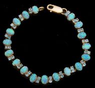 Modern 375 stamped opalescent and blue stone set articulated bracelet