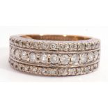 Half-hoop diamond cluster ring, a design with three rows of graduated small single cut diamonds,