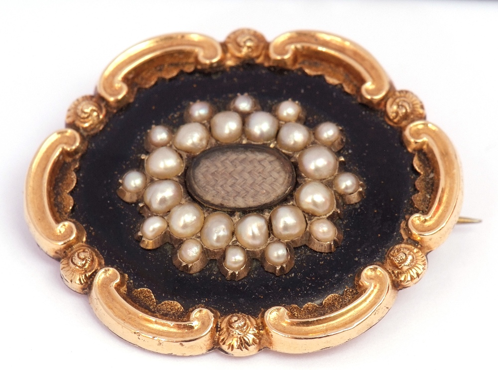 Early Victorian gold, black enamel and seed pearl mourning brooch, the centre with a glazed panel of - Image 2 of 5