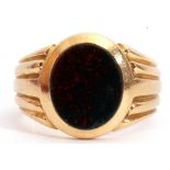 Antique gent's ring set with an oval cut bloodstone panel in rub-over setting, raised between