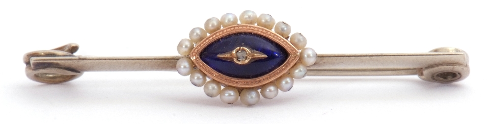 Antique and precious metal pin brooch, the knife edge bar centring a navette shaped blue enamel