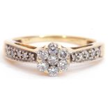 Diamond cluster ring, a design featuring a brilliant cut diamond cluster, raised above diamond set