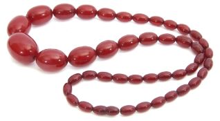 Vintage cherry amber bead necklace, a single row of graduated oblong beads, 1cm - 3cm wide, 73gms