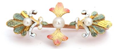 Antique enamel and seed pearl brooch featuring three graduated seed pearls set in translucent