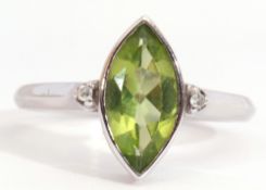 Modern 18ct white gold, peridot and diamond ring, the marquis shaped peridot in rub-over setting