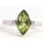 Modern 18ct white gold, peridot and diamond ring, the marquis shaped peridot in rub-over setting