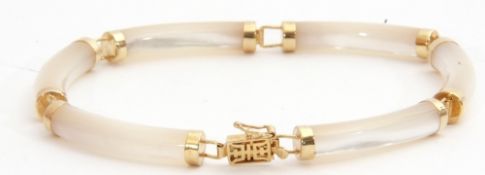 Modern 9ct stamped chalcedony bracelet comprising six shaped tubular chalcedony links, each capped