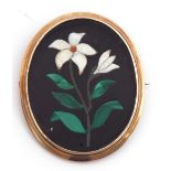 Antique pietra dura brooch of oval form, the centre with an open and closed flowerhead and green