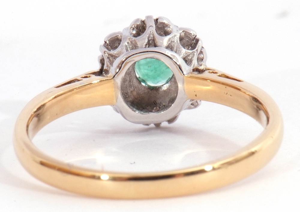 Modern 18ct gold emerald and diamond cluster ring, the round cut emerald four claw set and raised - Image 4 of 7