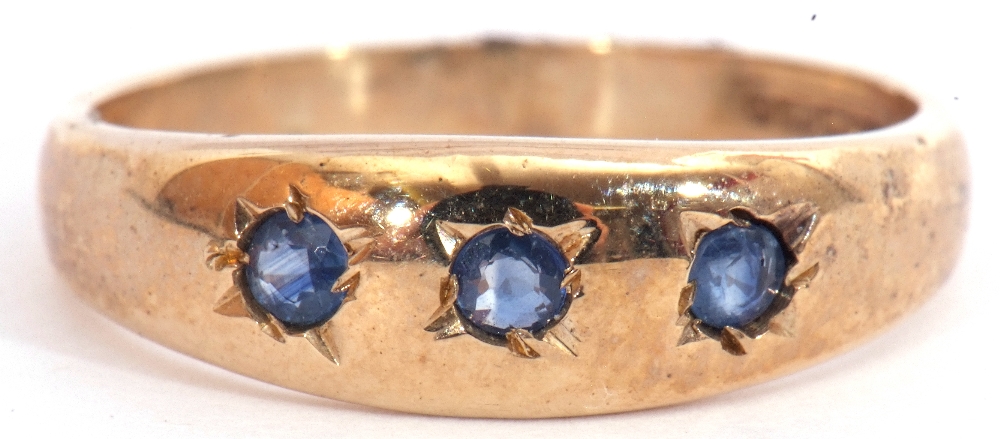 9ct gold sapphire three stone ring, the plain polished design featuring 3 round cut sapphires,