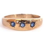 9ct gold sapphire three stone ring, the plain polished design featuring 3 round cut sapphires,