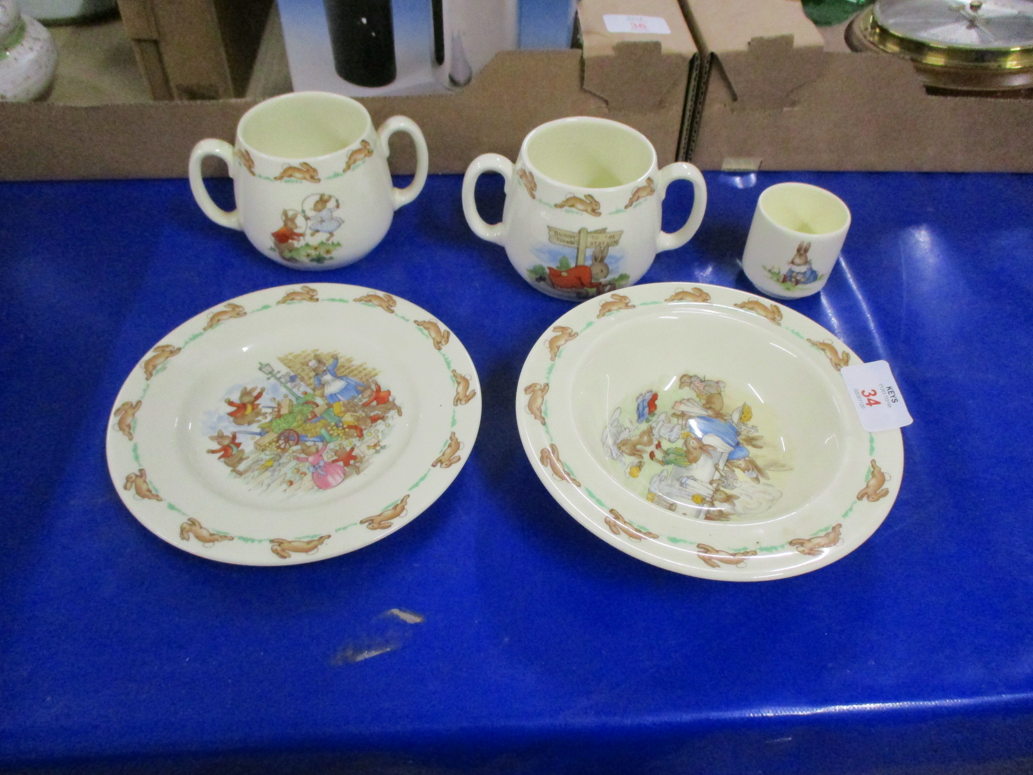 ROYAL DOULTON BUNNIKINS WARES INCLUDING TWO MUGS WITH LOOP HANDLES, A BOWL AND EGG CUP