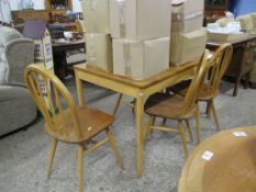 MODERN DINING SUITE COMPRISING A LIGHT WOOD TABLE AND FOUR STICK BACK CHAIRS