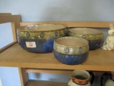 THREE DOULTON BOWLS WITH EMBOSSED FLORAL DECORATION TO RIM