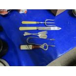 BOTTLE OPENER AND PLATED KNIFE AND FORK AND TEA SPOON AND SUGAR TONGS
