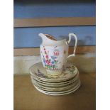 CROWN STAFFORDSHIRE JUG AND QUANTITY OF SAUCERS