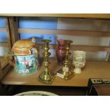 PAIR OF BRASS CANDLESTICKS AND A LARGE CERAMIC TEA POT AND COVER MODELLED AS A COUNTRY COTTAGE