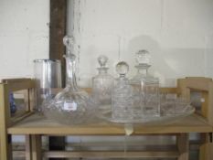 QUANTITY OF CUT GLASS WARES INCLUDING A NUMBER OF DECANTERS, FRUIT BOWL AND VASE